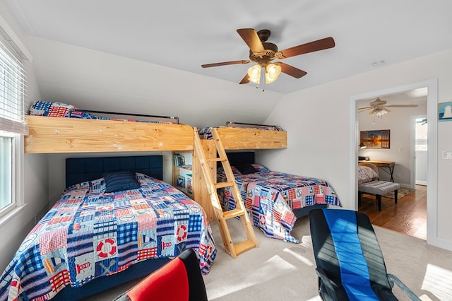 bedroom with carpet, ceiling fan, and lofted ceiling