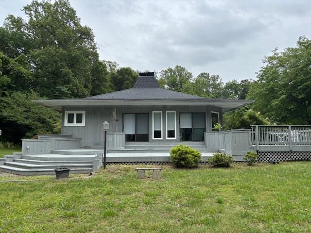 890 Gordon Way, Montross, VA 22520 - back of property featuring a chimney, a lawn, and a wooden deck