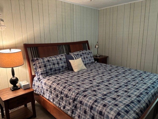 890 Gordon Way, Montross, VA 22520 - bedroom with wood walls, wood finished floors, and ornamental molding