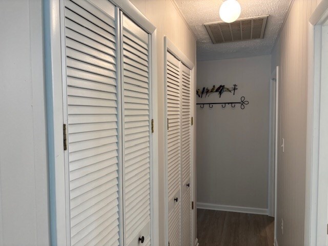 890 Gordon Way, Montross, VA 22520 - hall featuring wood finished floors and a textured ceiling