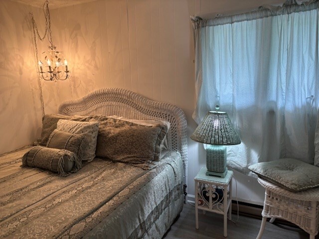 890 Gordon Way, Montross, VA 22520 - bedroom featuring wood finished floors and a chandelier