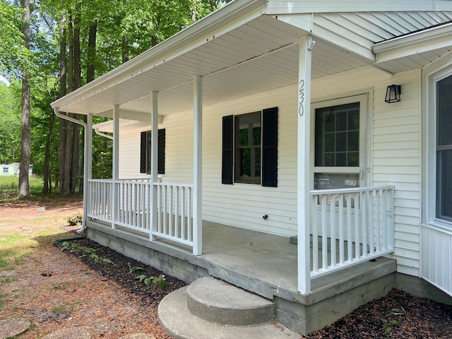 doorway to property featuring a porch