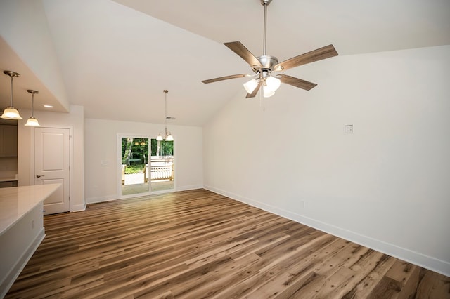 405 Cedar Ln, Colonial Beach, VA 22443 - unfurnished living room with wood finished floors, a chandelier, ceiling fan, recessed lighting, and high vaulted ceiling