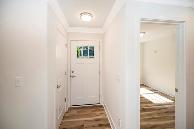 405 Cedar Ln, Colonial Beach, VA 22443 - doorway to outside featuring light wood-type flooring and crown molding