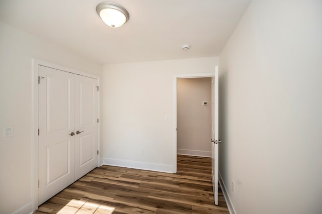 405 Cedar Ln, Colonial Beach, VA 22443 - unfurnished bedroom featuring wood finished floors and a closet