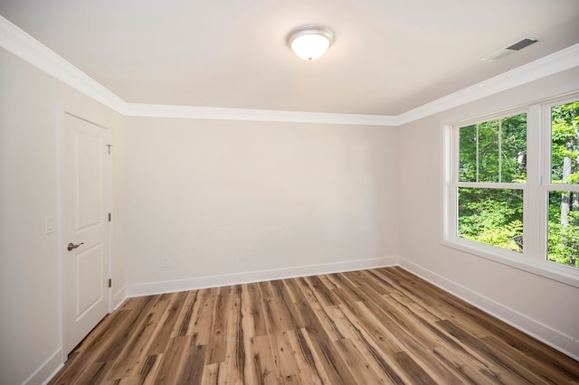 405 Cedar Ln, Colonial Beach, VA 22443 - empty room featuring crown molding and wood finished floors