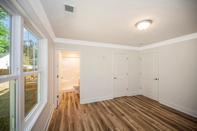 405 Cedar Ln, Colonial Beach, VA 22443 - unfurnished bedroom with crown molding, wood finished floors, and ensuite bathroom