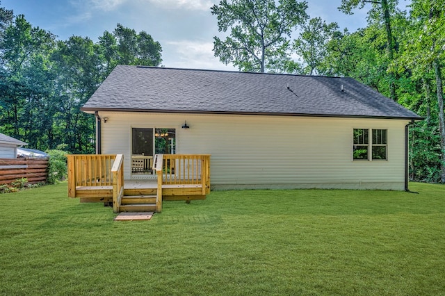 405 Cedar Ln, Colonial Beach, VA 22443 - back of property with roof with shingles, a wooden deck, and a lawn