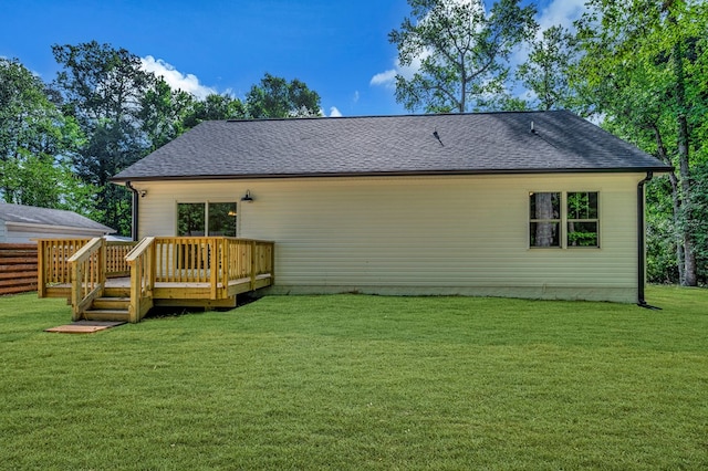 405 Cedar Ln, Colonial Beach, VA 22443 - back of house featuring a wooden deck, a lawn, and roof with shingles