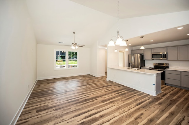 405 Cedar Ln, Colonial Beach, VA 22443 - kitchen with gray cabinets, stainless steel appliances, recessed lighting, light countertops, and dark wood-style floors