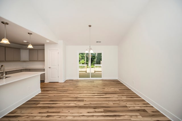 405 Cedar Ln, Colonial Beach, VA 22443 - unfurnished dining area with light wood-style floors, lofted ceiling, a chandelier, and recessed lighting