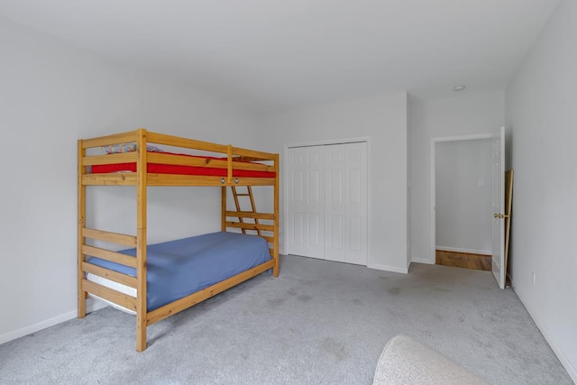 bedroom with carpet floors and a closet