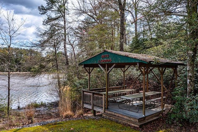 wooden terrace featuring a gazebo and a water view