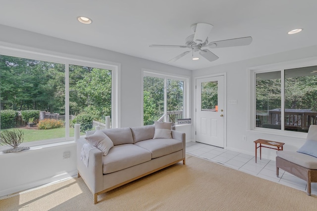 sunroom / solarium with ceiling fan and a wealth of natural light