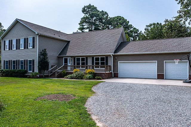view of front facade featuring a front yard, roof with shingles, a garage, and gravel driveway