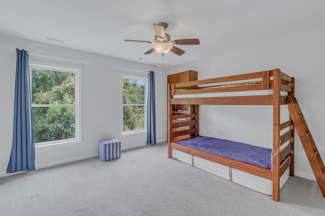 unfurnished bedroom with carpet and ceiling fan