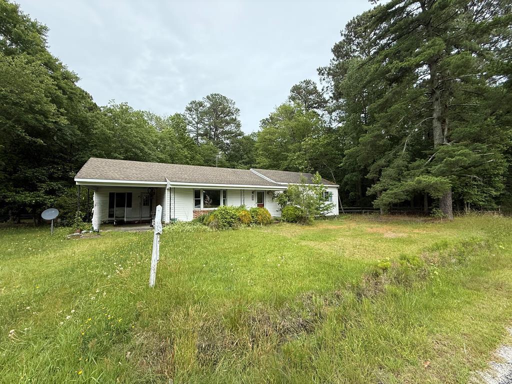 761 Chownings Ferry Rd, Lancaster, VA 22503 - view of front facade with a carport and a front lawn