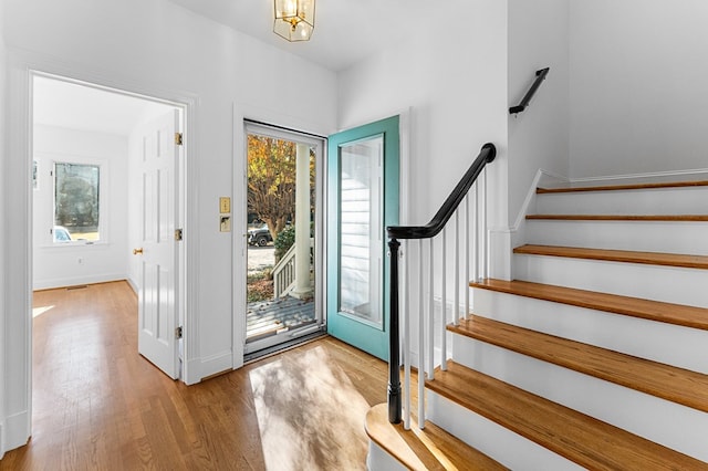 foyer entrance with light hardwood / wood-style flooring