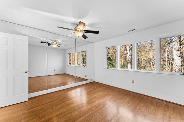 interior space with hardwood / wood-style flooring and ceiling fan