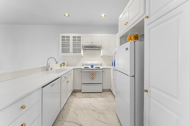 kitchen featuring sink, white cabinets, and white appliances