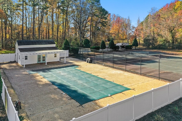 exterior space featuring a patio area and a pool