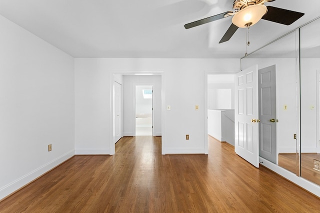 interior space with hardwood / wood-style flooring and ceiling fan