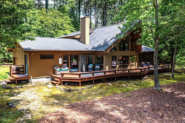 back of house featuring a deck