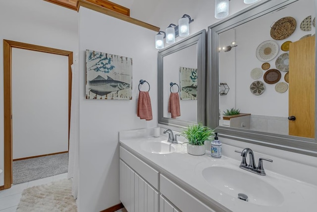 bathroom with tile patterned flooring and vanity