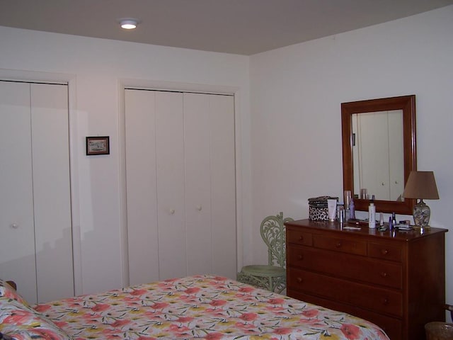 bedroom with two closets