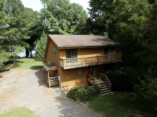 view of front facade with a wooden deck