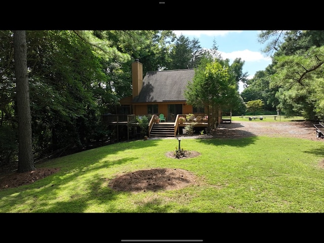 view of yard with a wooden deck