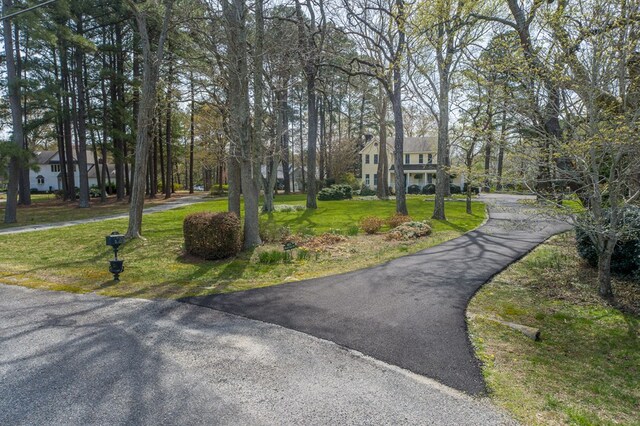 403 Moores Creek Dr, Deltaville, VA 23043 - surrounding community with a lawn and driveway