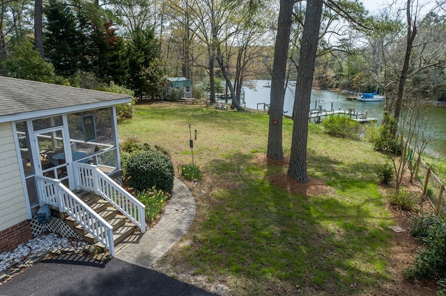 403 Moores Creek Dr, Deltaville, VA 23043 - view of green lawn featuring a water view and a sunroom