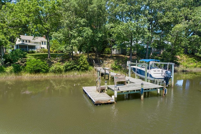 403 Moores Creek Dr, Deltaville, VA 23043 - dock area featuring boat lift, a water view, and view of scattered trees