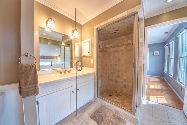 403 Moores Creek Dr, Deltaville, VA 23043 - full bathroom featuring vanity, crown molding, a stall shower, and tile patterned flooring