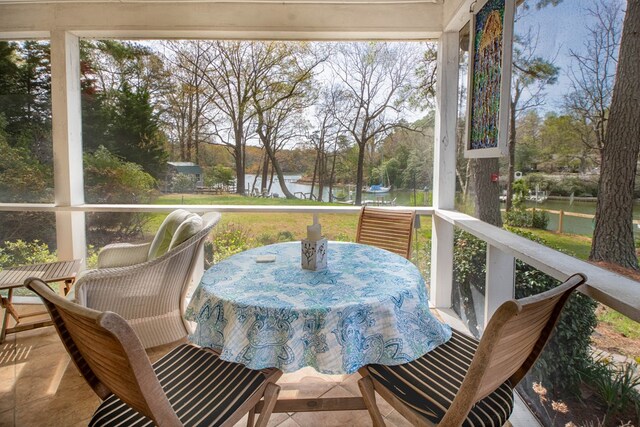 403 Moores Creek Dr, Deltaville, VA 23043 - sunroom / solarium featuring outdoor dining area, plenty of natural light, and view of scattered trees