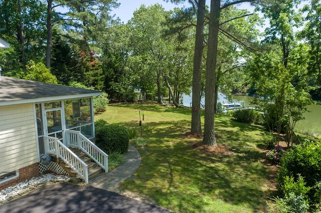403 Moores Creek Dr, Deltaville, VA 23043 - view of grassy yard featuring entry steps and a water view