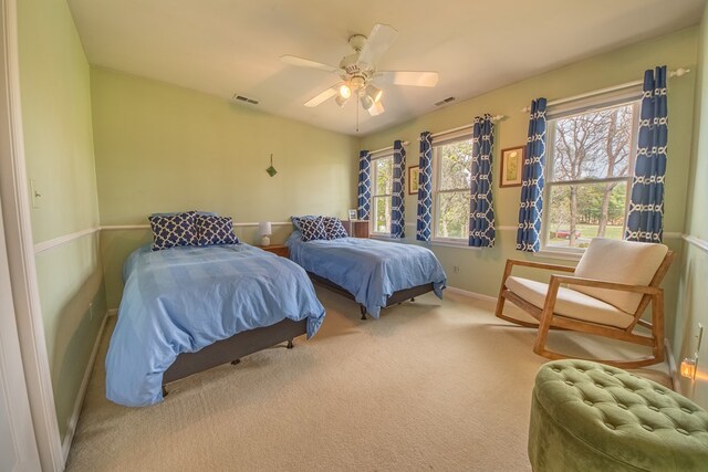 403 Moores Creek Dr, Deltaville, VA 23043 - bedroom with baseboards, carpet floors, and a ceiling fan