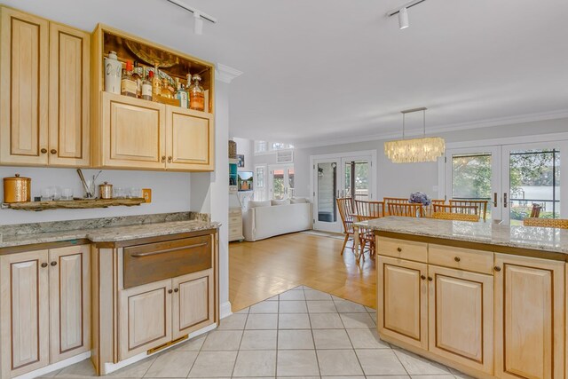 324 Bayberry Ln, Reedville, VA 22539 - kitchen featuring track lighting, french doors, light brown cabinetry, open floor plan, and crown molding