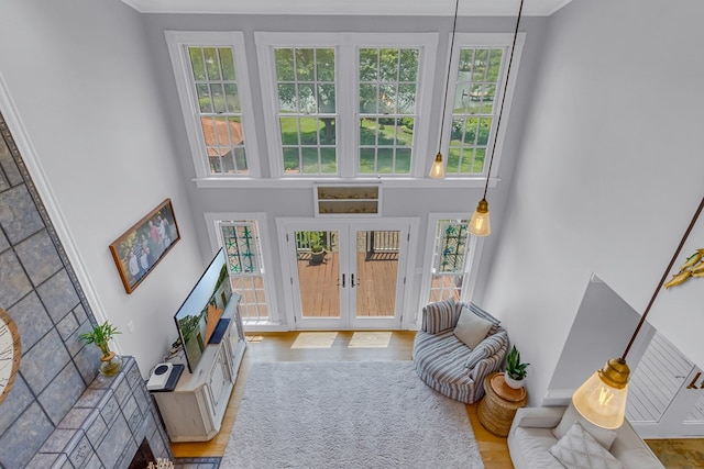 324 Bayberry Ln, Reedville, VA 22539 - foyer entrance featuring french doors, a towering ceiling, wood finished floors, and crown molding