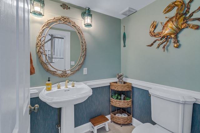 324 Bayberry Ln, Reedville, VA 22539 - bathroom with toilet, tile patterned floors, and wainscoting