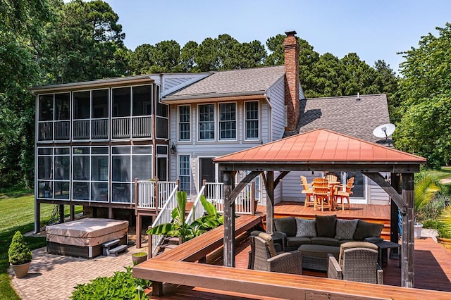 324 Bayberry Ln, Reedville, VA 22539 - deck featuring a gazebo, a hot tub, outdoor lounge area, a patio area, and a sunroom
