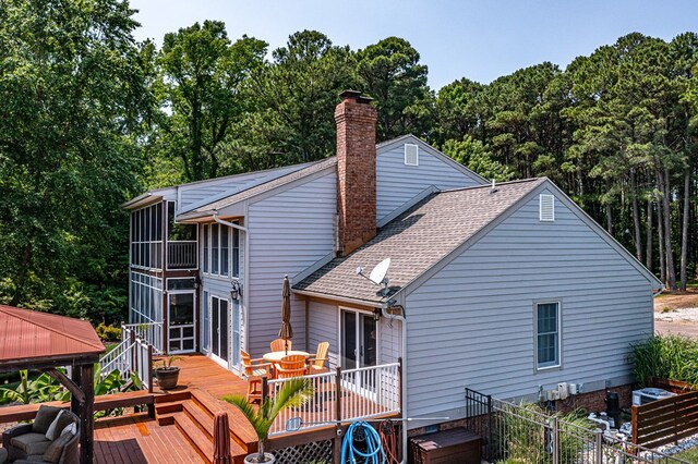 324 Bayberry Ln, Reedville, VA 22539 - rear view of house with a sunroom and a chimney