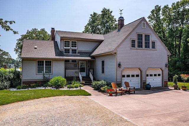 324 Bayberry Ln, Reedville, VA 22539 - view of front of property featuring a chimney, concrete driveway, an attached garage, and roof with shingles
