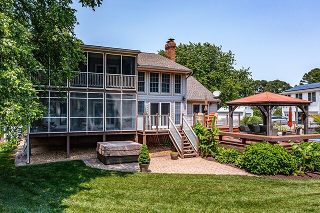 324 Bayberry Ln, Reedville, VA 22539 - back of property with a gazebo, a deck, a covered hot tub, and a lawn