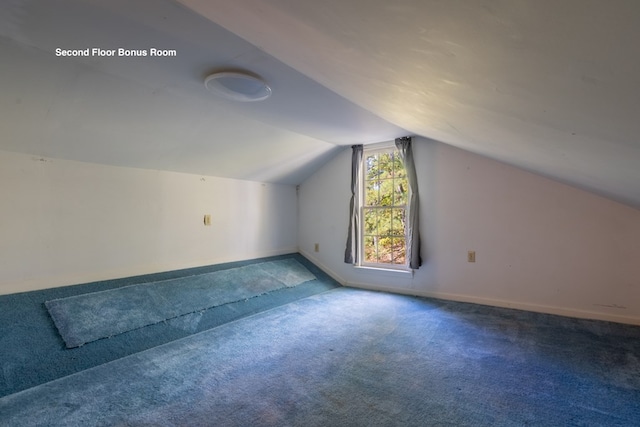 bonus room featuring carpet floors and lofted ceiling