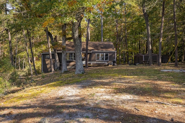 view of front of house with a shed