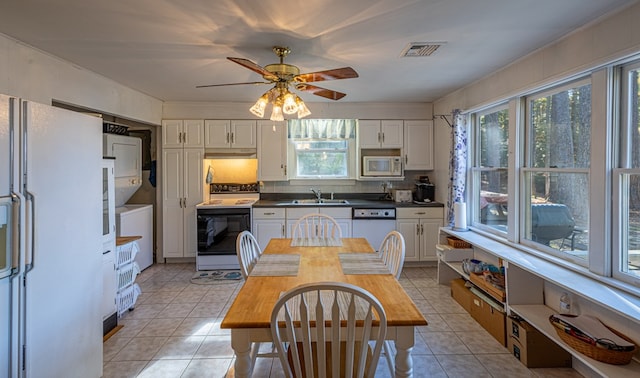 kitchen with white cabinetry, sink, ceiling fan, and white appliances