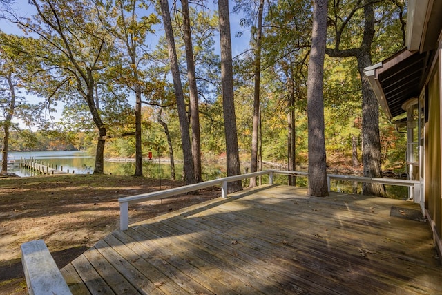 wooden terrace featuring a water view