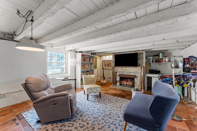 living area with wooden ceiling, beamed ceiling, and a fireplace